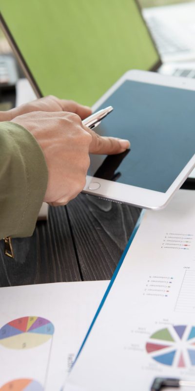 Image of two young woman business using touchpad at meeting.
business team meeting to discuss statistical data presented in the form of digital graphs and charts.