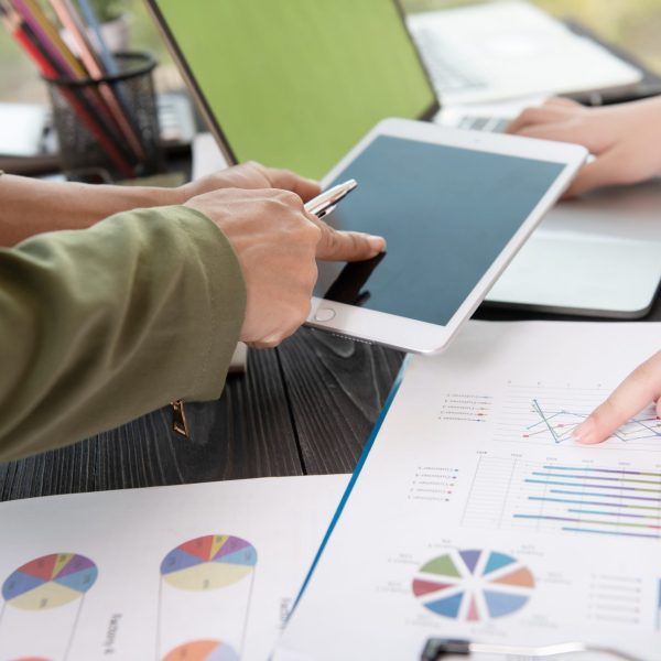Image of two young woman business using touchpad at meeting.bus Image of two young woman business using touchpad at meeting.
business team meeting to discuss statistical data presented in the form of digital graphs and charts.