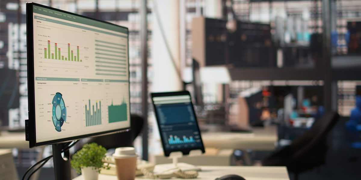 Empty high end office workspace with advanced technology to enhance efficiency, helping business professionals focus on financial strategies. Global enterprise success objectives.